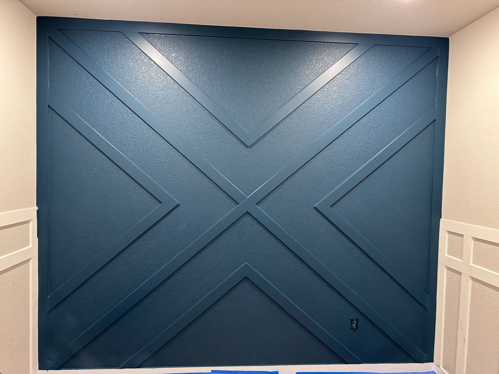 Navy accent wall with custom woodwork