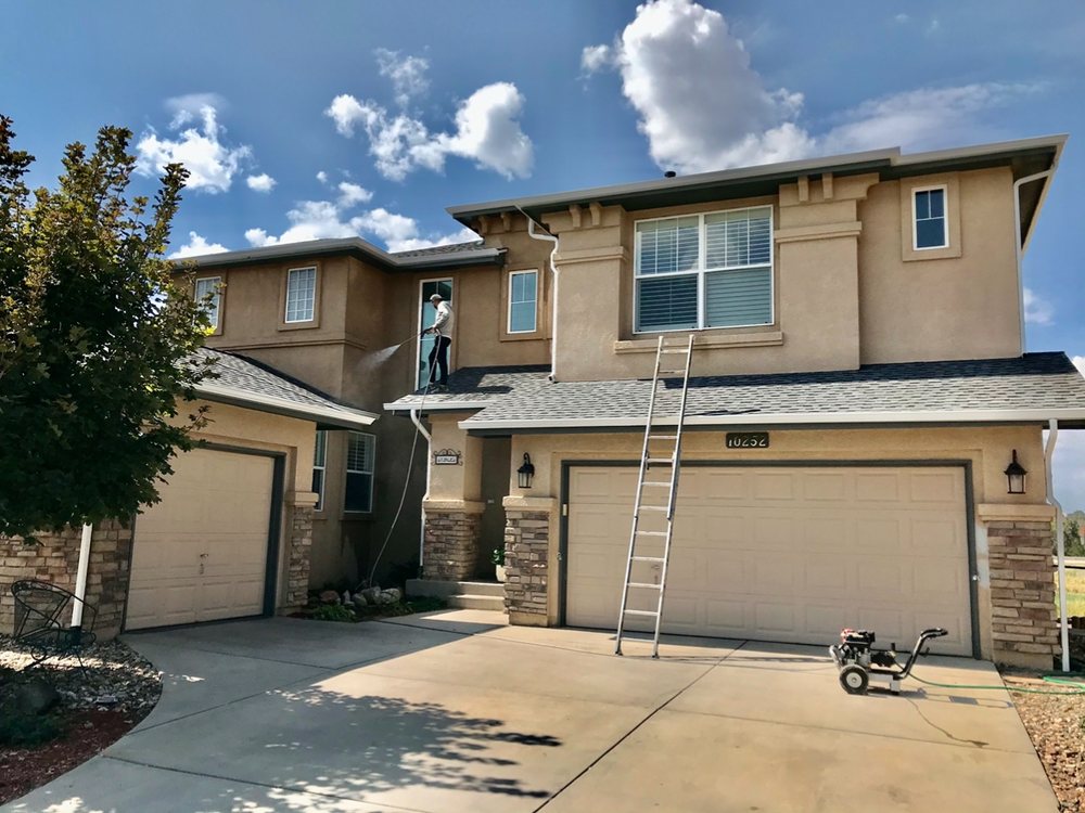 Two-story home exterior painting